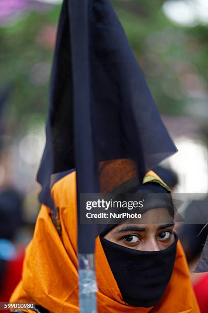 Activists of Bangladesh Centre for Workers Solidarity form a human chain in Dhaka, on March 30, 2014 demanding justice for Aminul Islam a trade union...