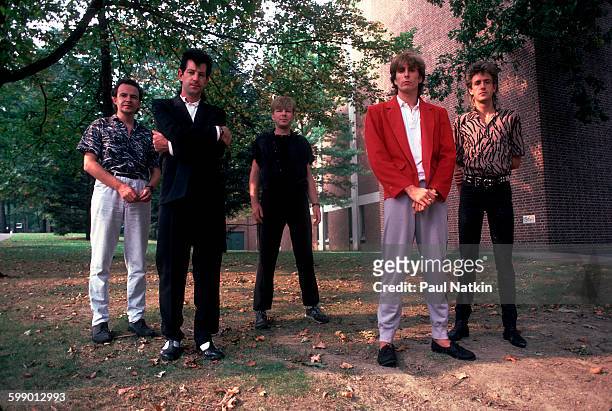 Portrait of British New Wave group the Fixx as they pose outdoors at Penn State University, State College, Pennsylvania, September 23, 1984. Pictured...