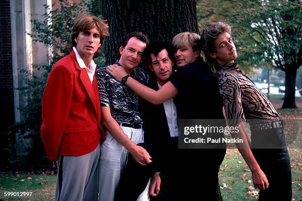 Portrait of British New Wave group the Fixx as they pose outdoors at Penn State University, State College, Pennsylvania, September 23, 1984. Pictured...