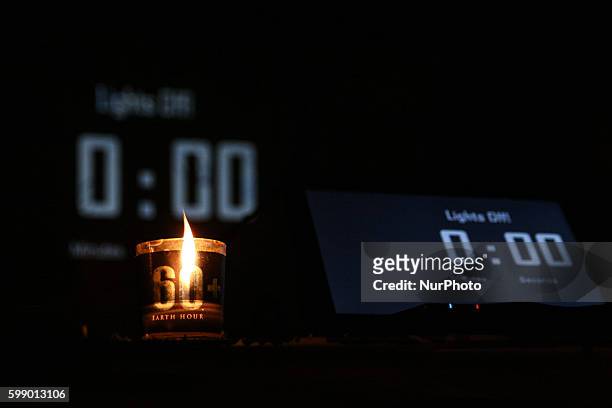One of the candles lighted, as a symbol of hope, during the official start of the Earth Hour lights off celebration in Makati City. -- Hundreds of...