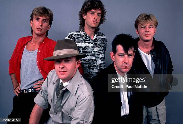 Portrait of British New Wave group the Fixx as they pose at the Poplar Creek Music Theater, Hoffman Estates, Illinois, July 5, 1986. Pictured are,...