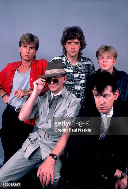 Portrait of British New Wave group the Fixx as they pose at the Poplar Creek Music Theater, Hoffman Estates, Illinois, July 5, 1986. Pictured are,...