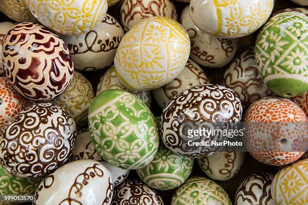 Popular traditional Polish pisanki, hand painted Easter eggs, on display in Krakow's Easter Market. Polish pisanka are eggs richly ornamented using...