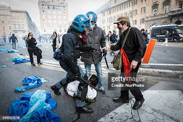 Rome, Italy â€" April 12, 2014: Demonstrators clash with police during an anti-austerity demonstration in Rome. Thousands protesters, from all over...