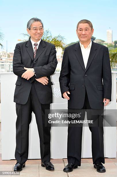 Masayuki Mori and Takeshi Kitano at the photo call for ?Outrage? during the 63rd Cannes International Film Festival.