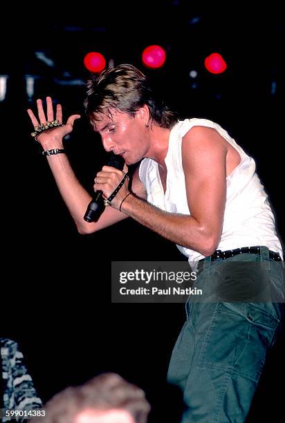 British New Wave musician Cy Curnin, of the Fixx, performs onstage at the Poplar Creek Music Theater, Hoffman Estates, Illinois, July 5, 1986.