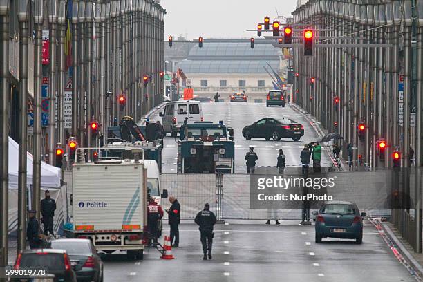 Security perimeter fence stands on Wetstraat in Brussels, Belgium, on March 23, 2016. Police continue investigations after yesterday's explosions at...