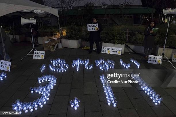 In the Shibuya district of central Tokyo got together a group of people to remind the disaster of March 11, 2011 with Candles, they wrote 3·11 with...