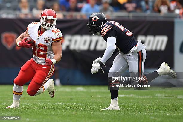 Anthony Sherman of the Kansas City Chiefs is pursued by Danny Trevathan of the Chicago Bears during a game at Soldier Field on August 27, 2016 in...