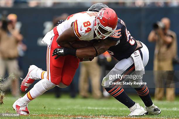 Demetrius Harris of the Kansas City Chiefs is brought down by Danny Trevathan of the Chicago Bears during a game at Soldier Field on August 27, 2016...