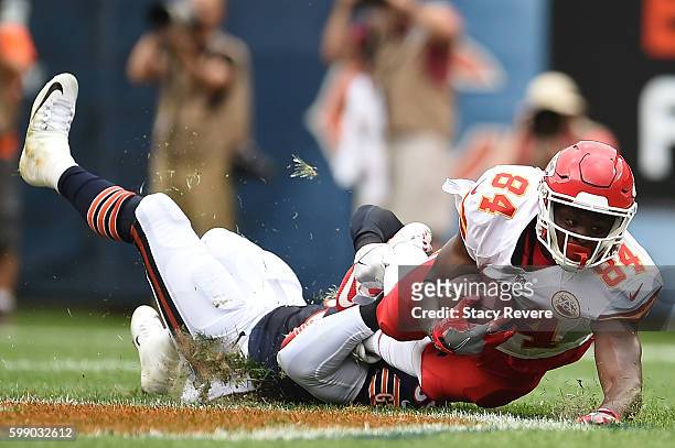 Demetrius Harris of the Kansas City Chiefs is brought down by Danny Trevathan of the Chicago Bears during a game at Soldier Field on August 27, 2016...