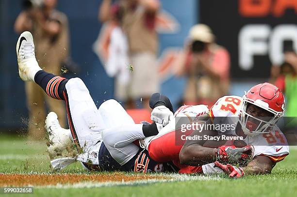 Demetrius Harris of the Kansas City Chiefs is brought down by Danny Trevathan of the Chicago Bears during a game at Soldier Field on August 27, 2016...