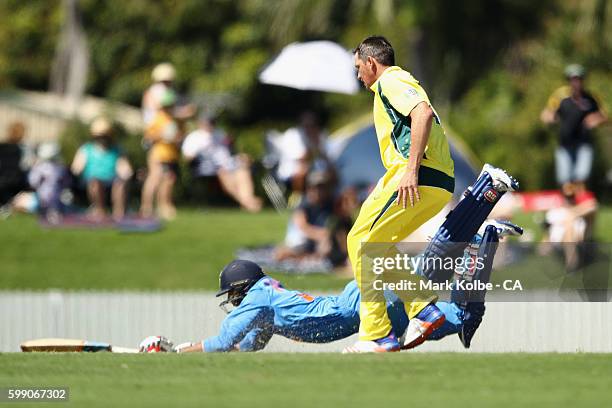 Axar Patel of India A dives to makes his ground under pressure from Chris Tremain during the Cricket Australia via Getty Images Winter Series Final...