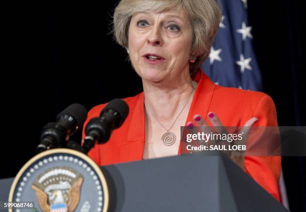 British Prime Minister Theresa May speaks during a press conference following a meeting with US President Barack Obama on the sidelines of the G20...