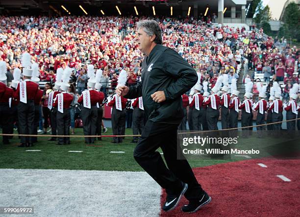 Head coach Mike Leach of the Washington State Cougars takes the field prior to the start of the game against the Eastern Washington Eagles at Martin...