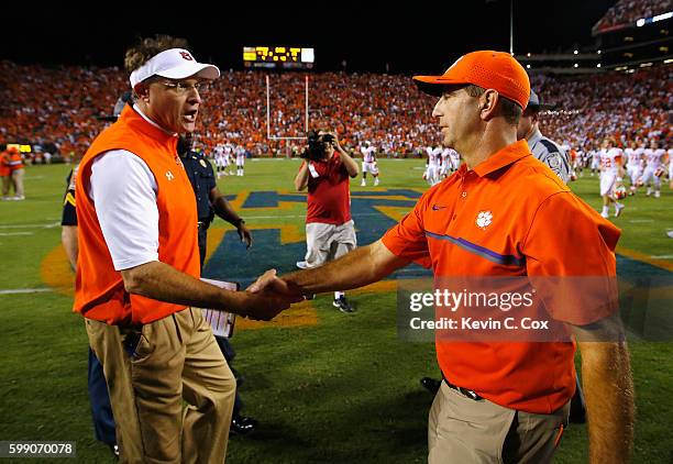 Head coach Gus Malzahn of the Auburn Tigers shakes hands with head coach Dabo Swinney of the Clemson Tigers after their game at Jordan Hare Stadium...