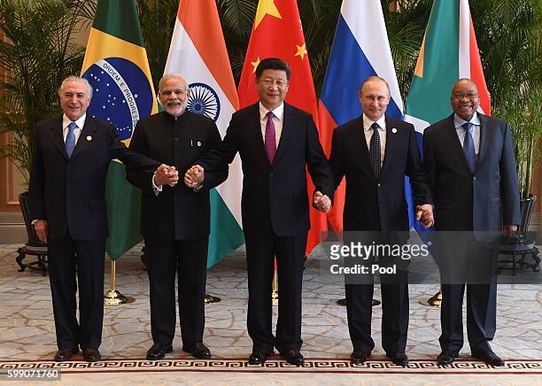 Chinese President Xi Jinping takes a group photo with Indian Prime Minister Narendra Modi , Brazil's President Michel Temer ,Russian President...