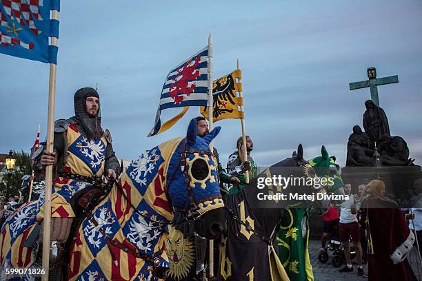 Men wearing medieval knight's costumes ride horses during a two-day re-enactment of crowning celebrations from September 2, 1347 when Charles IV was...