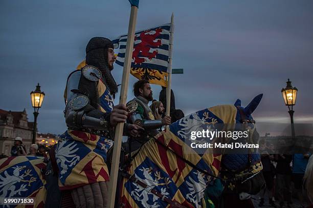 Men wearing medieval knight's costumes ride horses during a two-day re-enactment of crowning celebrations from September 2, 1347 when Charles IV was...