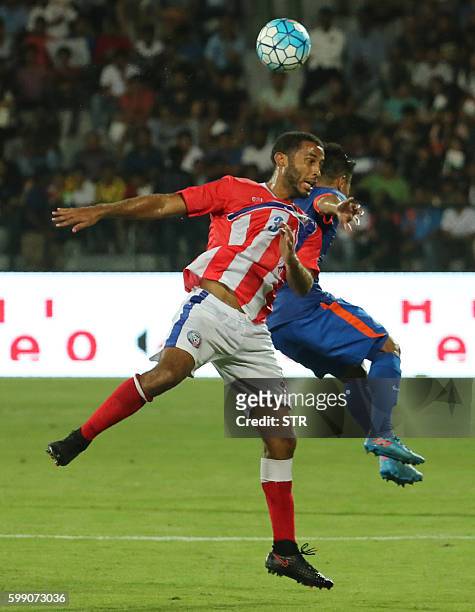 Jacob Conde of Puerto Rico vies for the ball with Jeje Lalpekhlua of India during a friendly football match between India and Puerto Rico in Mumbai...