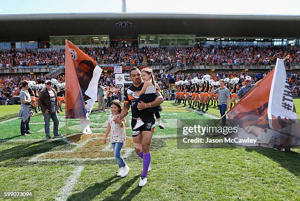 Dene Halatau of the Tigers makes his way onto the field during the round 26 NRL match between the Wests Tigers and the Canberra Raiders at Leichhardt...