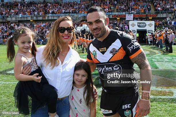 Dene Halatau of the Tigers poses with his wife Rochelle during the round 26 NRL match between the Wests Tigers and the Canberra Raiders at Leichhardt...