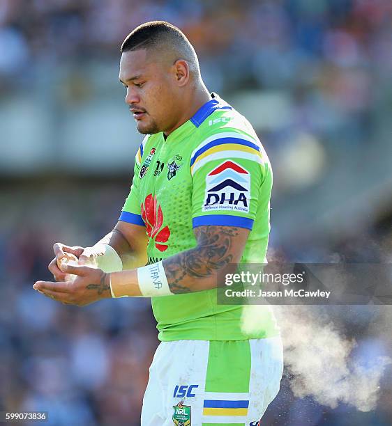 Joey Leilua of the Raiders sprays his hands during the round 26 NRL match between the Wests Tigers and the Canberra Raiders at Leichhardt Oval on...