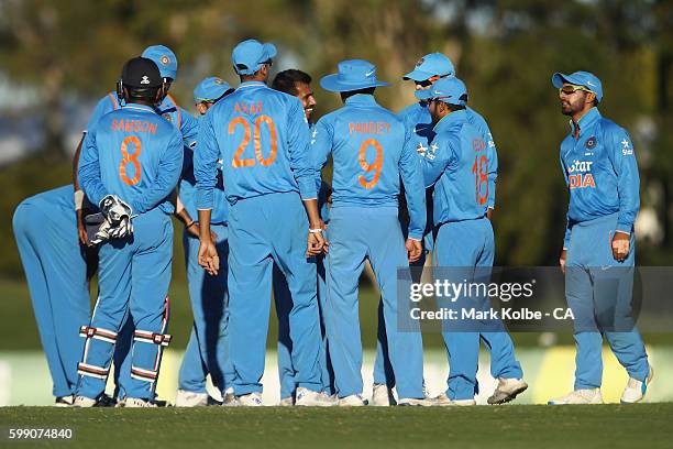 Yuzvendra Chahal of India A celebrates with his team mates after dismissing Kane Richardson of Australia during the Cricket Australia via Getty...