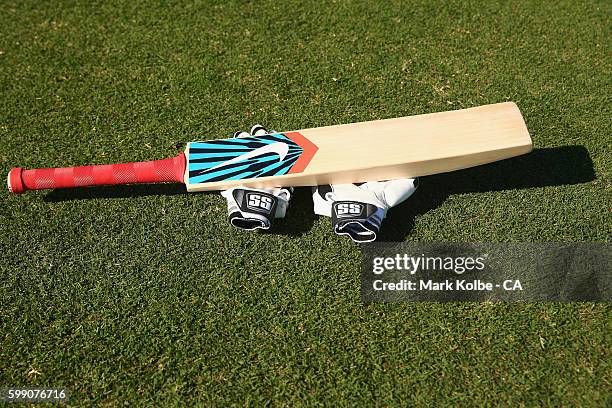 General view is seen of a cricket bat and gloves during warm-up ahead of the Cricket Australia via Getty Images Winter Series Final match between...