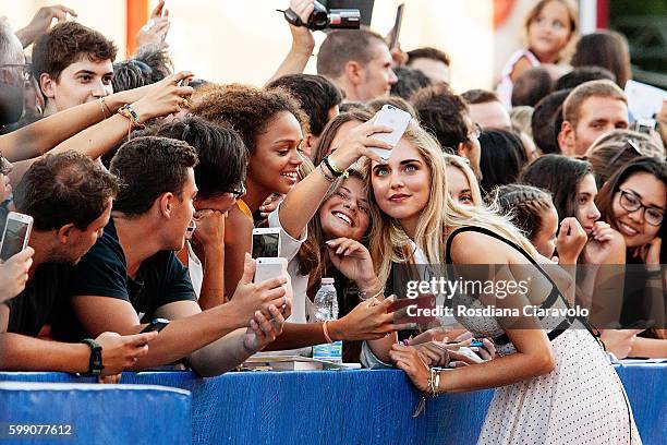 Chiara Ferragni poses for fans at the premiere of 'The Young Pope' during the 73rd Venice Film Festival at Palazzo del Casino on September 3, 2016 in...