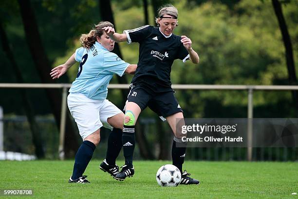 Claudia Schulz of Niendorf and Sabine Stuermer of Dirmingen compete for the ball during the match between Niendorfer TSV and SV Dirmingen at DFB...