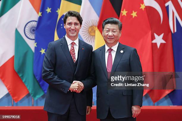 Chinese President Xi Jinping shakes hands with Canadian Prime Minister Justin Trudeau to the G20 Summit on September 4, 2016 in Hangzhou, China....