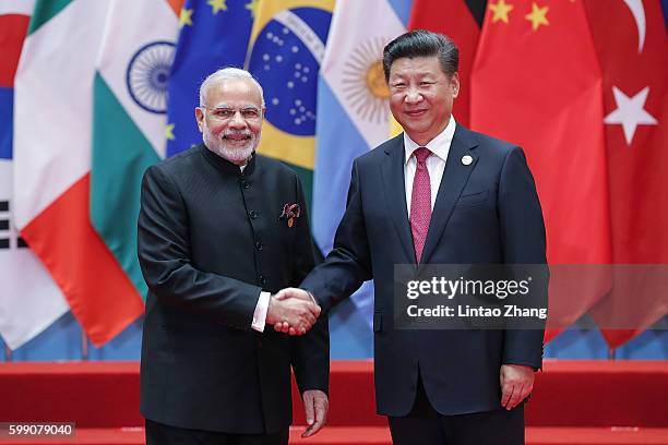 Chinese President Xi Jinping shakes hands with Indian Prime Minister Narendra Modi to the G20 Summit on September 4, 2016 in Hangzhou, China. World...