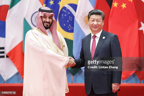 Chinese President Xi Jinping shakes hands with Saudi Arabian Deputy Crown Prince and Minister of Defense Mohammed bin Salman bin Abdulaziz Al Saud to...