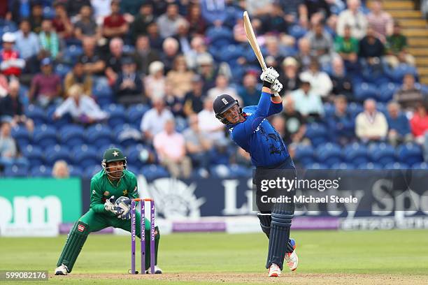 Jason Roy of England hits a straight six off the bowling of Shoaib Malik as wicketkeeper Sarfraz Ahmed looks on during the 5th Royal London One-Day...