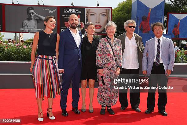 Directors Martina Parenti and Massimo D'Anolfi, actors Sabina Scharer, Marina Vlad, Felix Rohner and scientist Shin Kubota attend a photocall for...