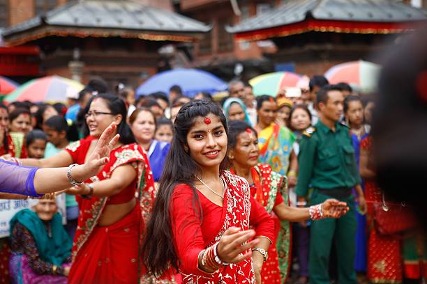Nepalese Hindu women sing and dance after paying homage to Lord Shiva, the Hindu god of destruction during the Teej festival in Kathmandu, Nepal on...