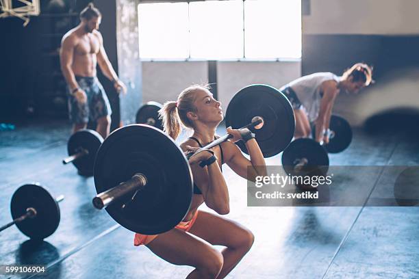 weightlifting class - thruster stock pictures, royalty-free photos & images