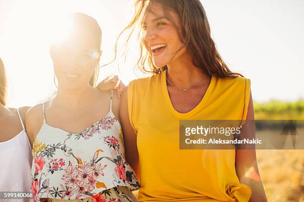 having fun with my girlfriends - yellow dress stock pictures, royalty-free photos & images