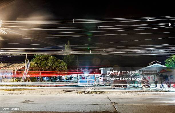 asian street at night, thailand - road richtung power station bei nacht stock-fotos und bilder