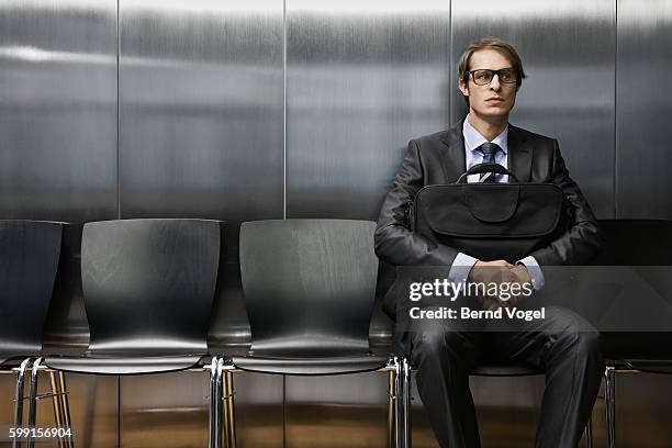 businessman in waiting room - vorstellungsgespräch stock-fotos und bilder