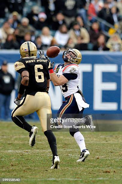 Navy Midshipmen running back John Howell makes a touchdown reception in action against Army Black Knights cornerback Donovan Travis in the 111th Army...