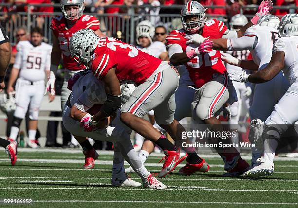 Ohio State Buckeyes linebacker Joshua Perry sacks Maryland Terrapins quarterback Perry Hills during the game between the Ohio State Buckeyes and the...