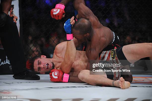Michael Page lands a punch to Charlie Ontiveros as they battle at the Mohegan Sun Arena in Uncasville, Connecticut. Michael Page defeats Charlie...
