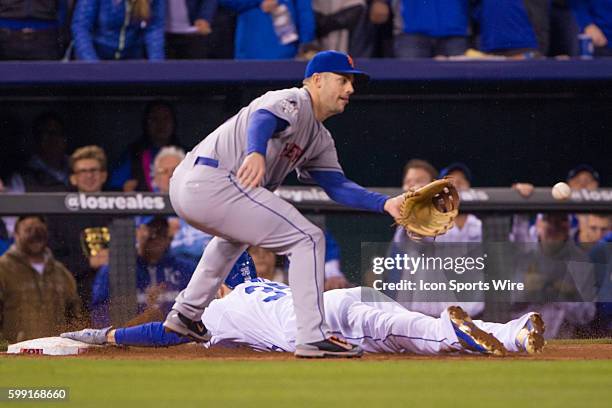 Kansas City Royals first baseman Eric Hosmer dives into 3rd base ahead of the throw during the World Series game 2 between the New York Mets and the...