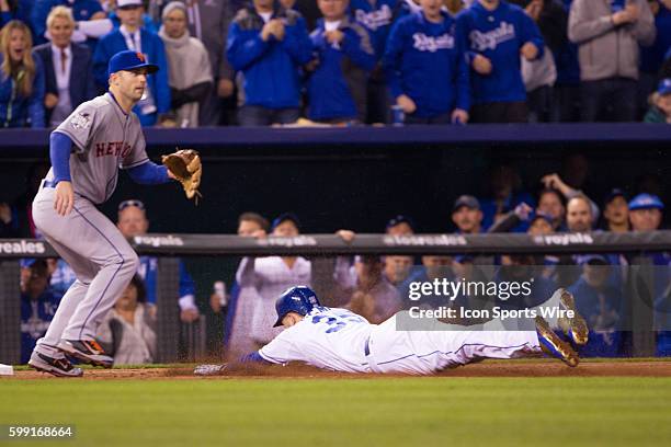 Kansas City Royals first baseman Eric Hosmer dives into 3rd base ahead of the throw during the World Series game 2 between the New York Mets and the...