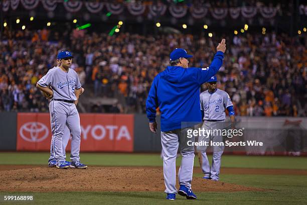 Kansas City Royals manager Ned Yost points to the bullpen as he heads out to relieve Kansas City Royals starting pitcher Jason Vargas in the 5th...
