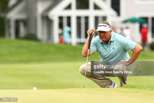 Ken Duke lines up a putt on the 3rd green during the third round of the Travelers Championship at TPC River Highlands in Cromwell, CT.