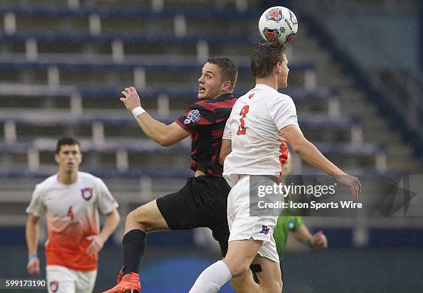 Clemson Patrick Bunk-Andersen beats Stanford Jordan Morris to a header during the final of the 2015 men's College Cup at Children's Mercy Park, in...