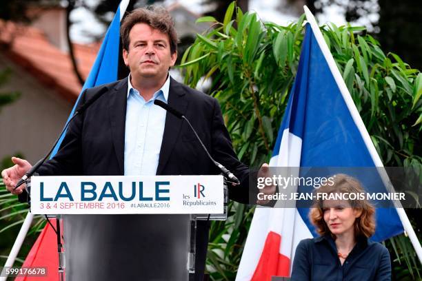 French lawmaker and right-wing "Les Republicains" party member Thierry Solere, delivers a speech, flanked by French member of Parliament and...